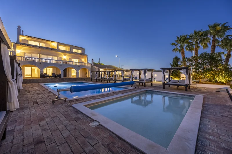 The house and pool terrace in the evening light